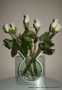 Roses in clear vase with glass stones
