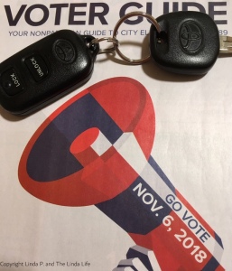 2018 NYC voter guide with car key and clicker